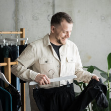 Philip Hammermeister putting clothes on a hanger
