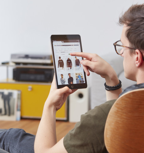 Zalando customer browsing the webshop on a tablet computer in a home environment
