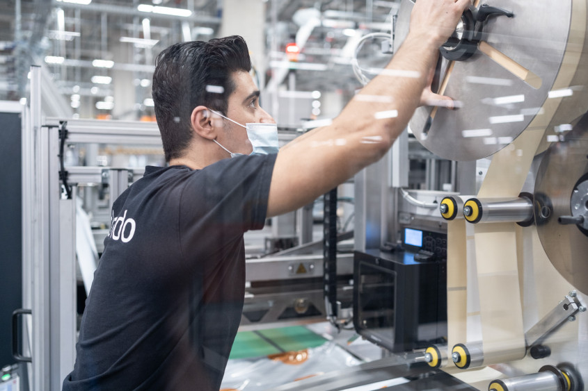 Zalando employee working on logistics machinery