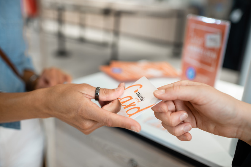 an outlet card being exchanged between hands