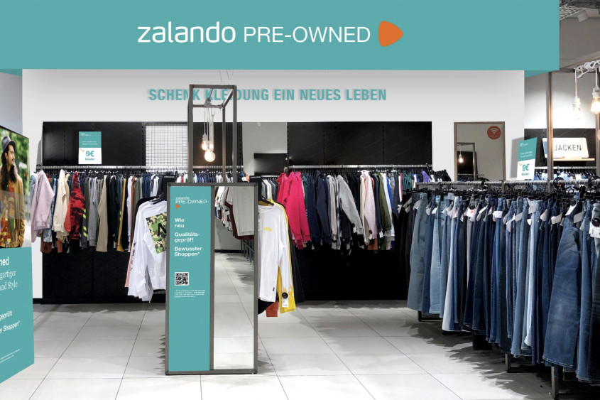 inside an outlet store, rows of clothes