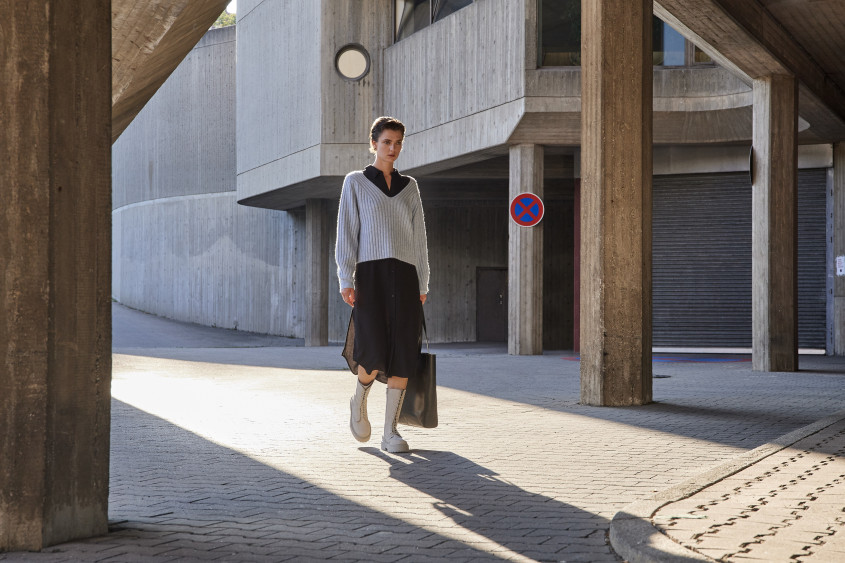 A woman walking straight to the camera