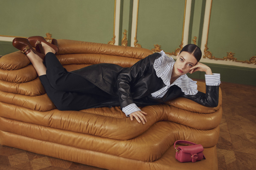 Fashion model lounging on a sofa