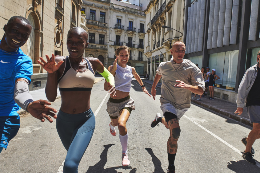 Young people in sportswear running in the street