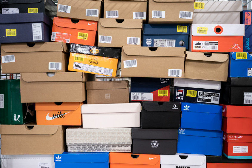 lots of stacked different coloured shoeboxes filling the picture