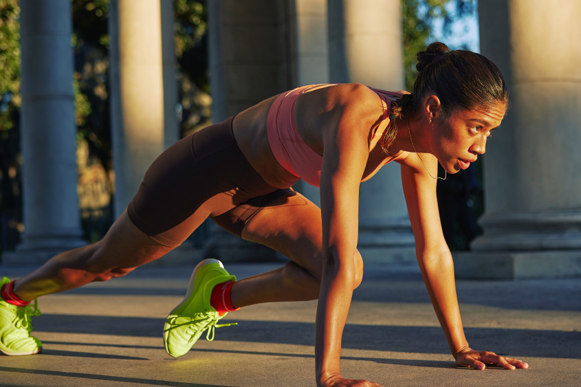 Female runner in starting pose