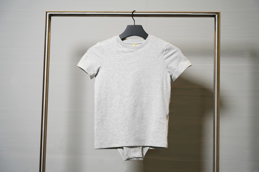 Grey tshirt covering the body under layer