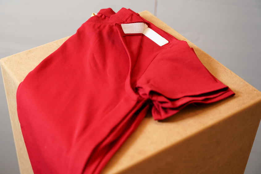 Red t-shirt with hook-and-loop fasteners on the front side