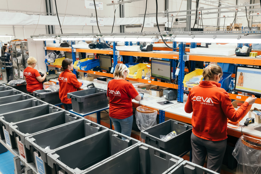 Returns center workers at their workstations.
