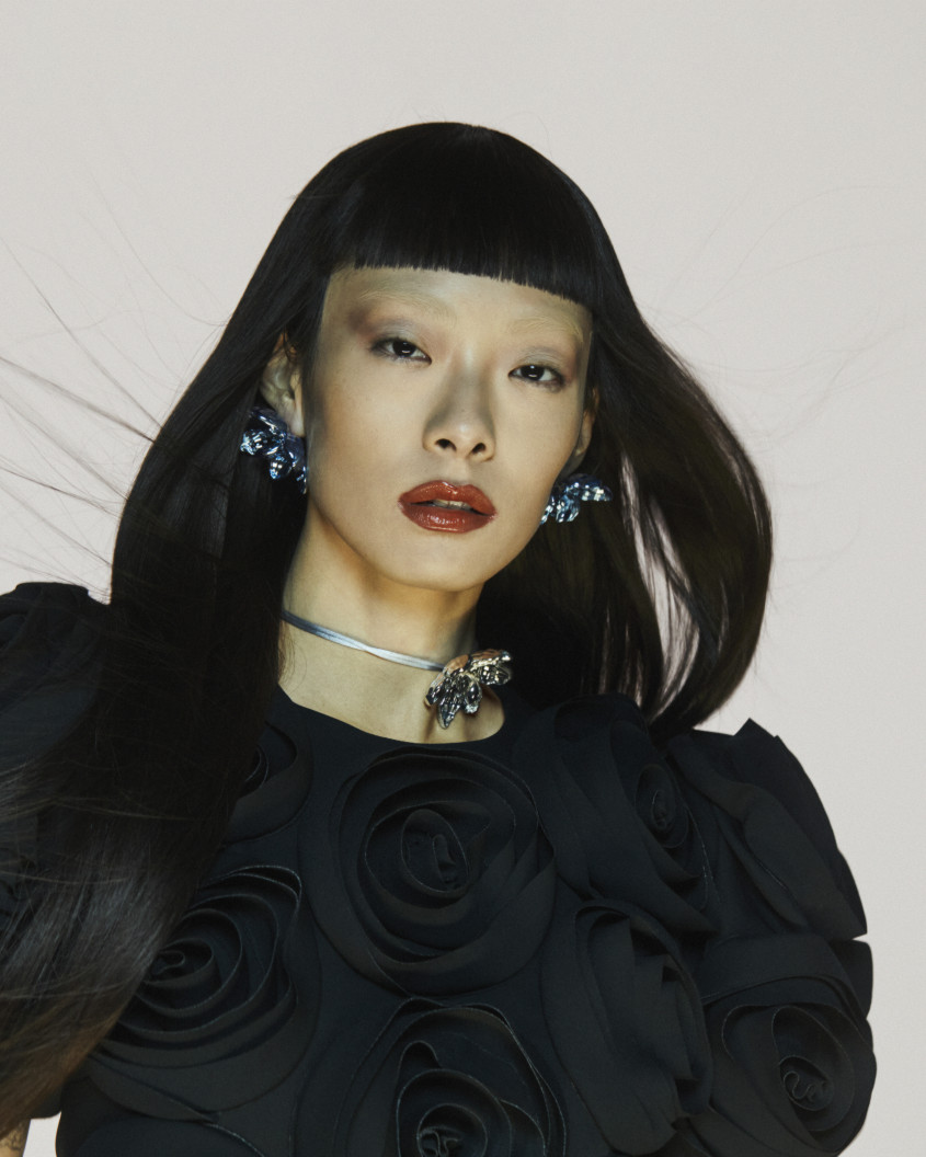 Rina Sawayama in a black outfit and a silver necklace for Zalando