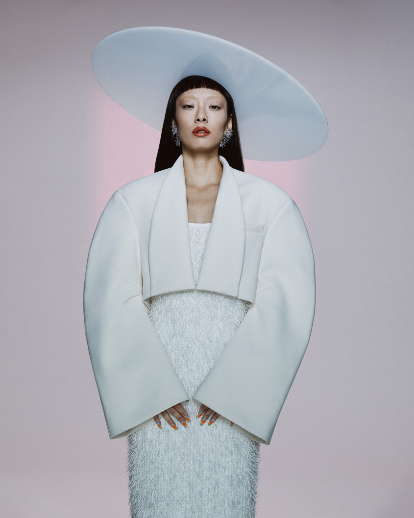 Rina Sawayama in a white outfit with a large hat for Zalando