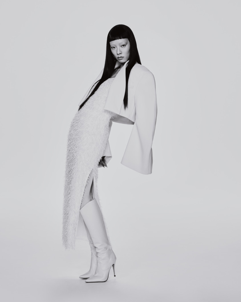 Rina Sawayama in black and white wearing a white dress and jacket for Zalando