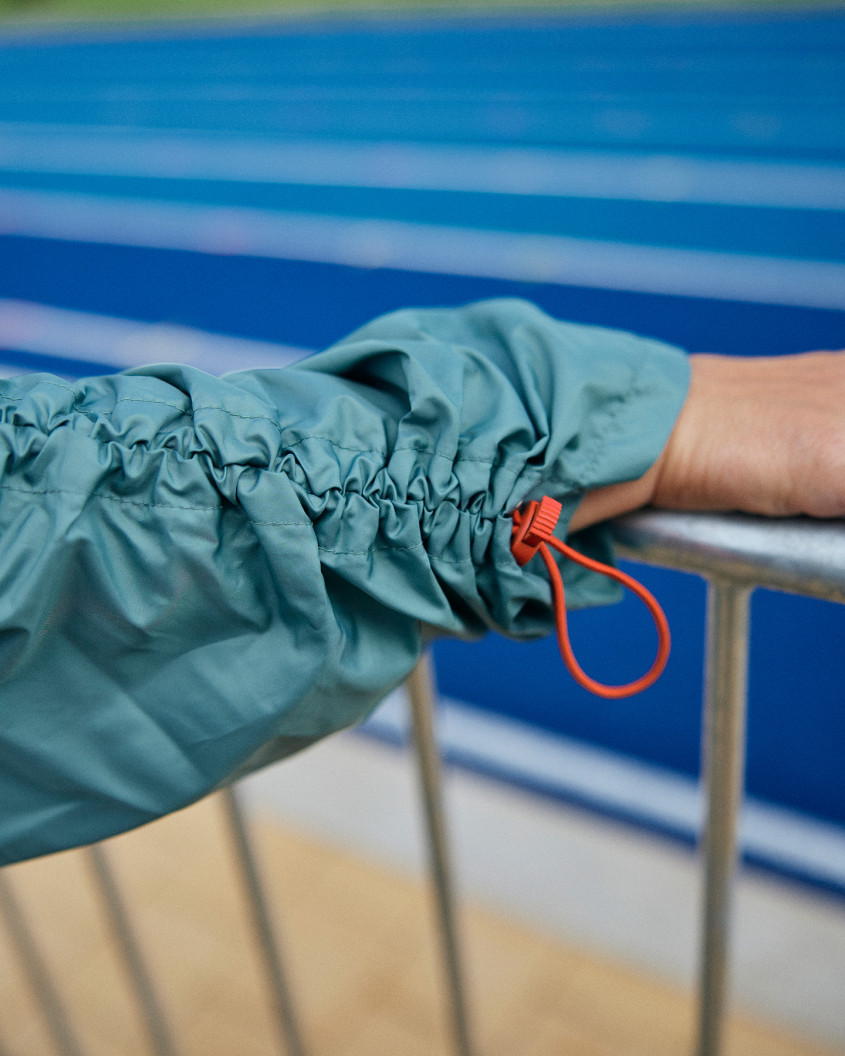 Close-up of fashion detail on the arm.