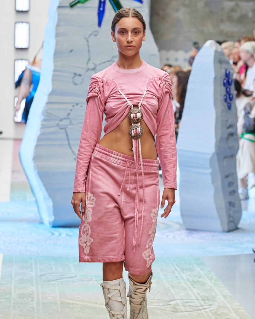 Fashion model on the runway; wlaking directly towards the camera