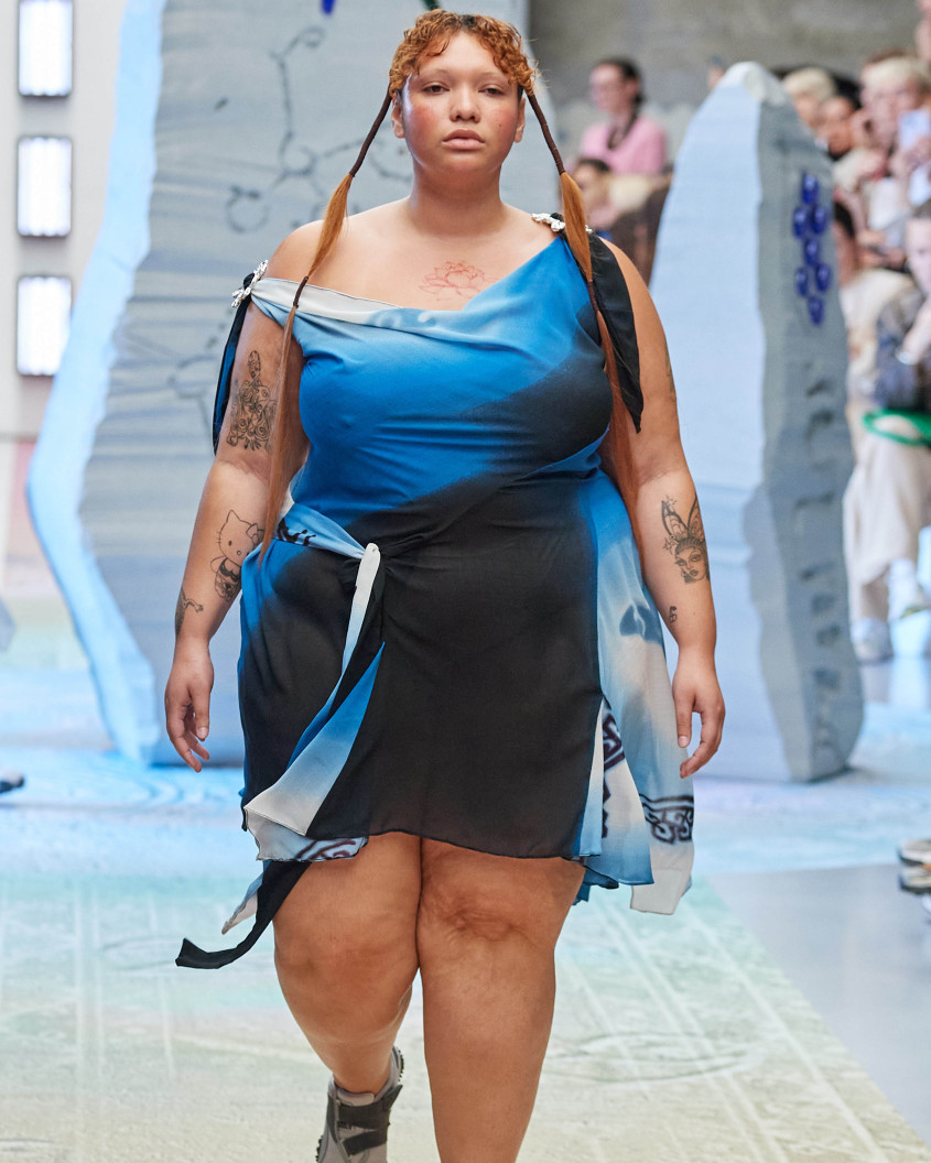 Fashion model on the runway; wlaking directly towards the camera