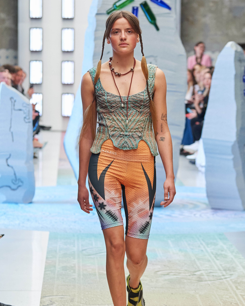 Fashion model on the runway; wlaking directly towards the camera