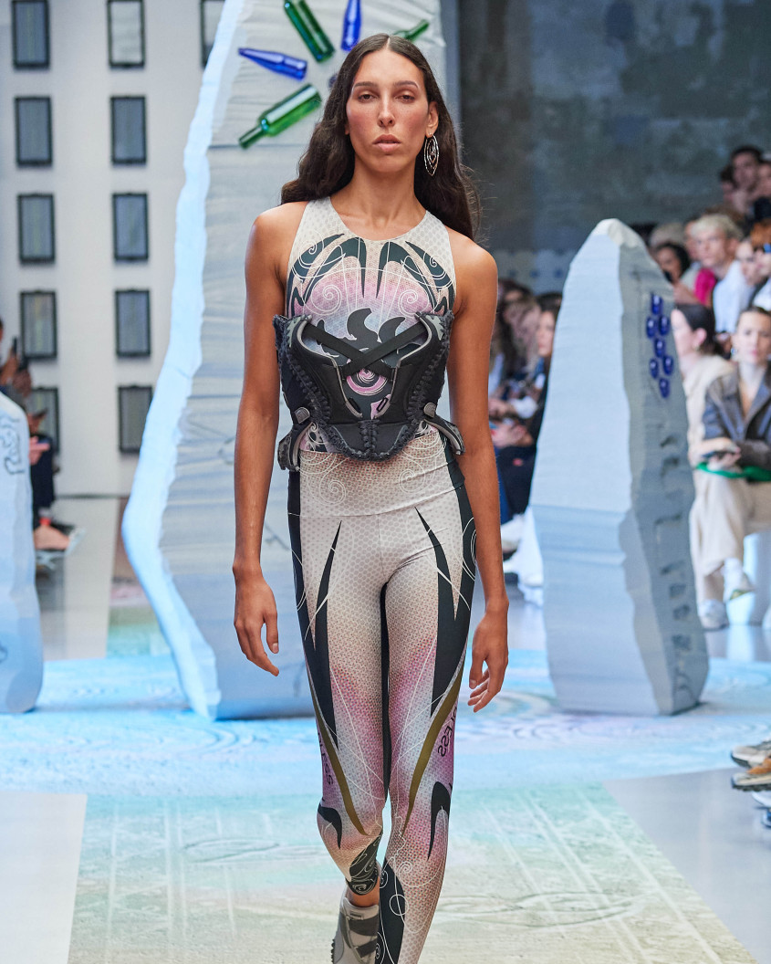 Fashion model on the runway; wlaking directly towards the camera