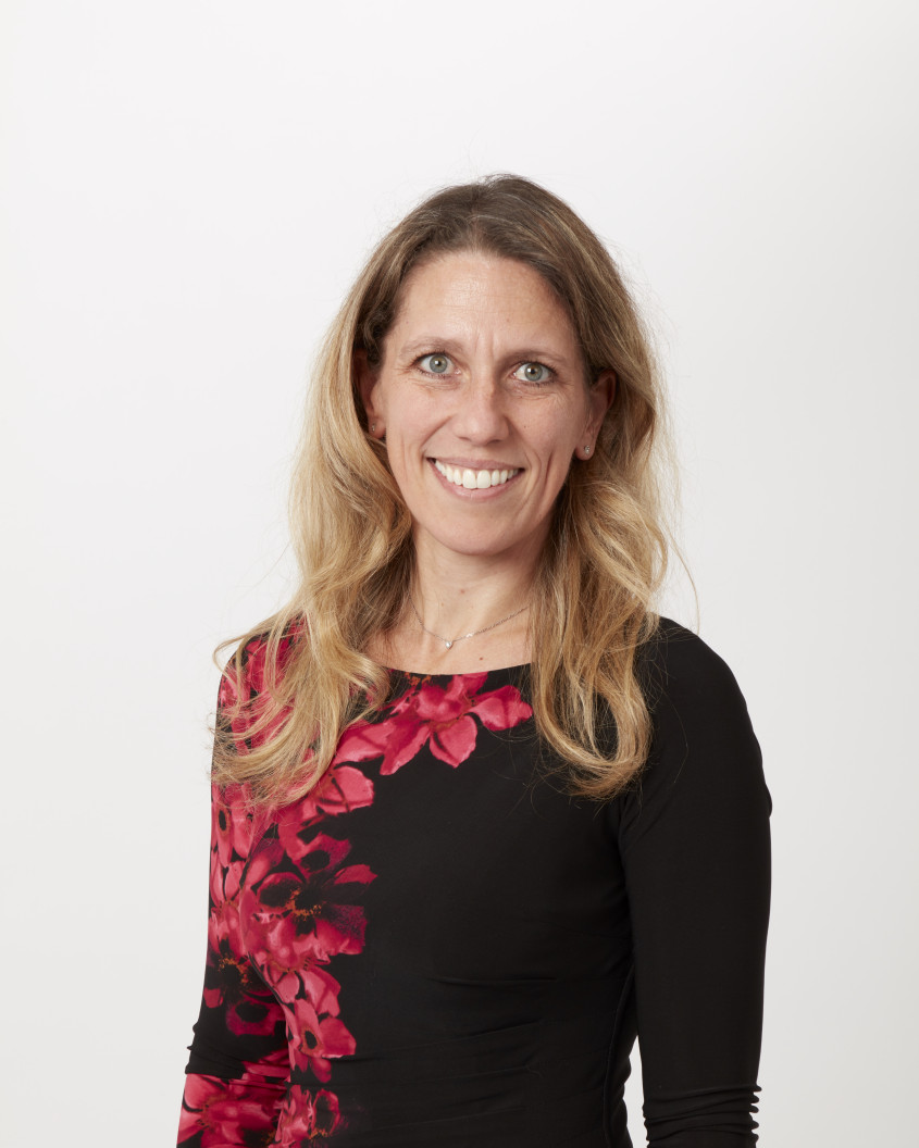 Portrait of Sandra Dembeck smiling at the camera