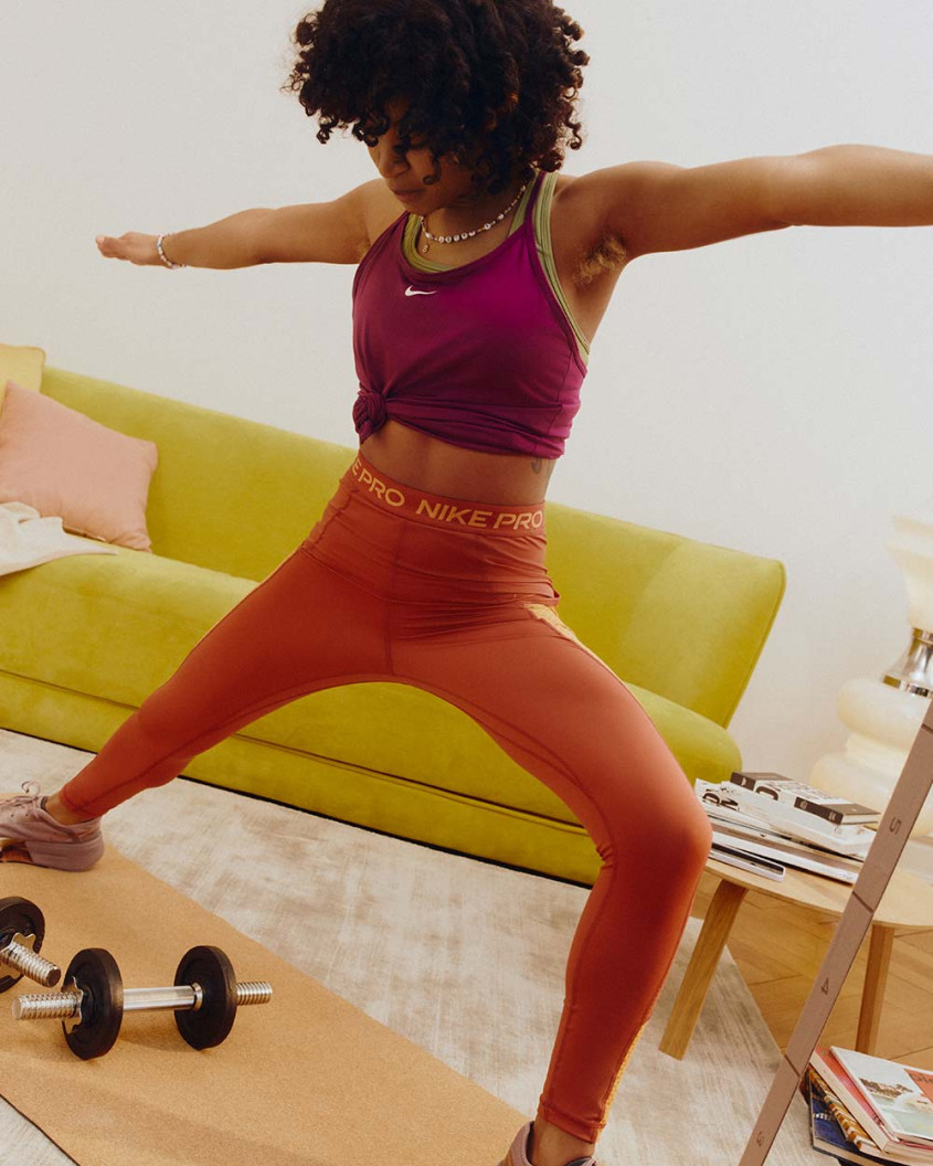 femal model working out in a living room setting