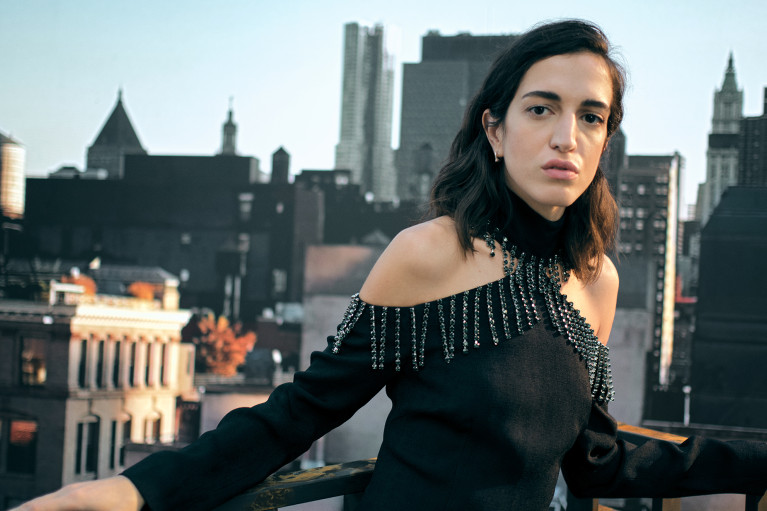 Fashion model in front of an impressive skyline backdrop