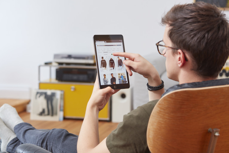 Zalando customer browsing the webshop on a tablet computer in a home environment