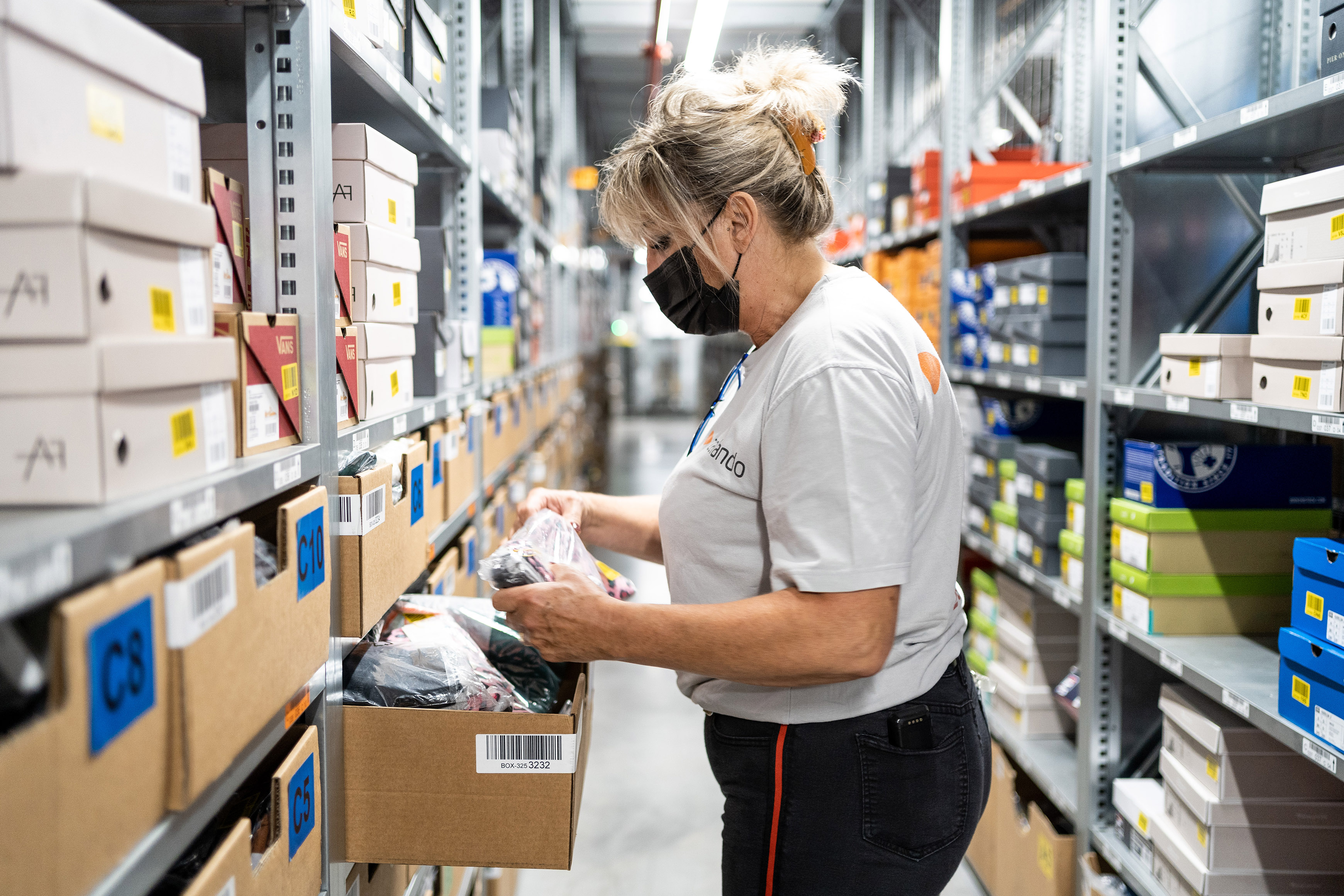 Female logistics employee sorting products