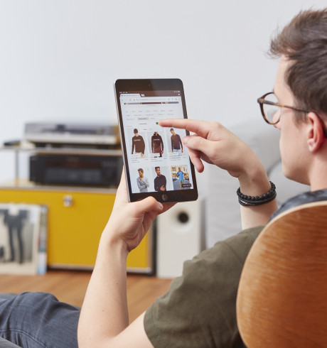 Zalando customer browsing the webshop on a tablet computer in a home environment
