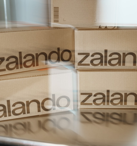 Slightly blurry picture of five Zalando-branded parcels