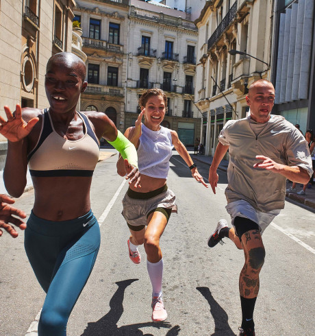 Young people in sportswear running in the street