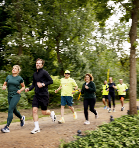 Group of people running in a park