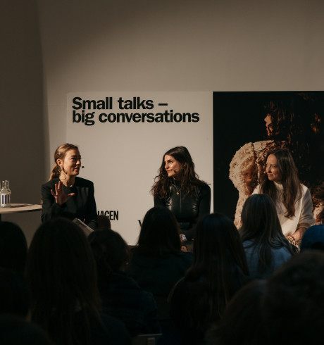 Four women during a panel discussion; the backdrop reads: Small talks - big conversation