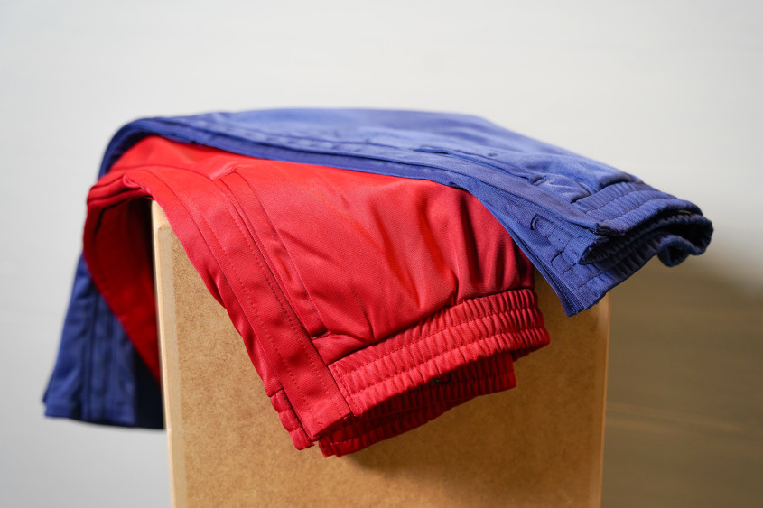 red and blue trousers with buttons on the side