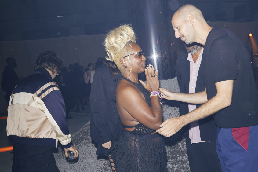 Bubu Ogisi standing talking to someone