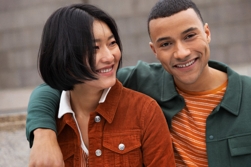 Two people laughing at the camera