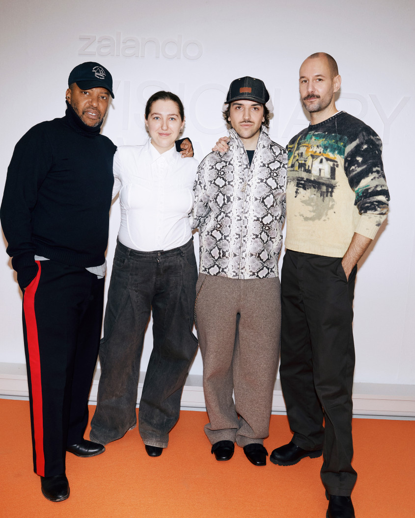 The four jury members posing in front of a white Zalando-branded backdrop