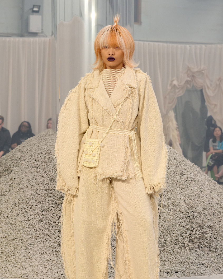 Fashion model in a big white suit