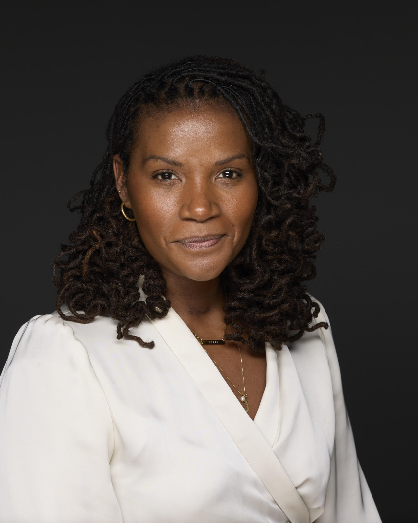 portrait of Tulani André against a dark backdrop