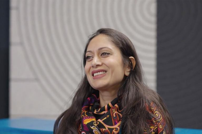 Padmaja Bommareddy smiling during her interview