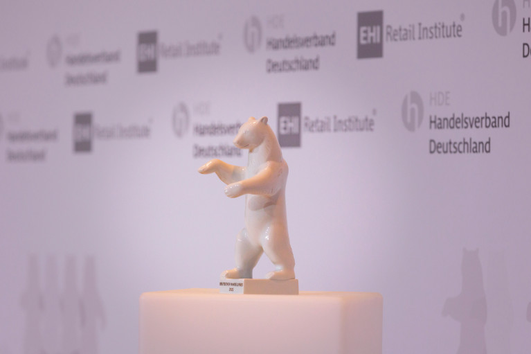 a trophy, a white bear, on a pedestal