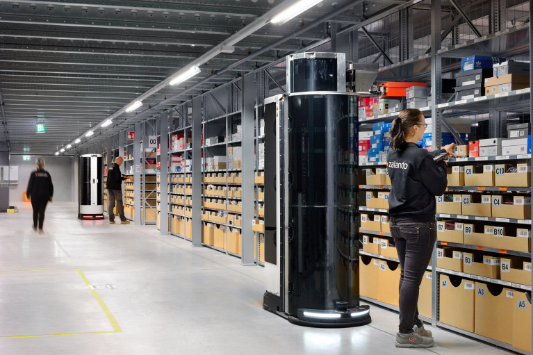 Zalando warehouse with employees working alongside mobile robots