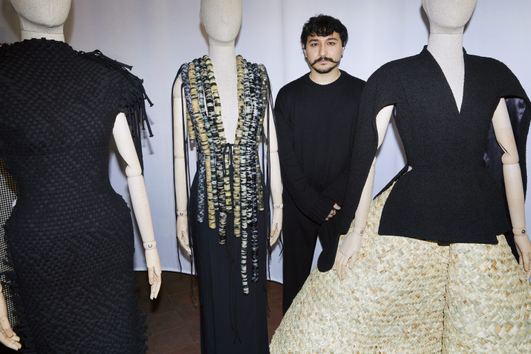 Galib Gassanoff standing between his designs